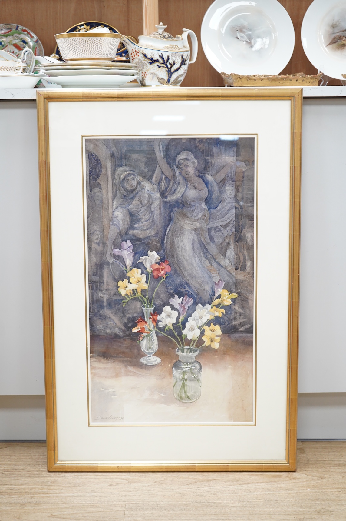 David Henley (b.1949), Still life of flowers in vases with classical figures beyond, signed and dated, 1997, watercolour, 66 x 38cm